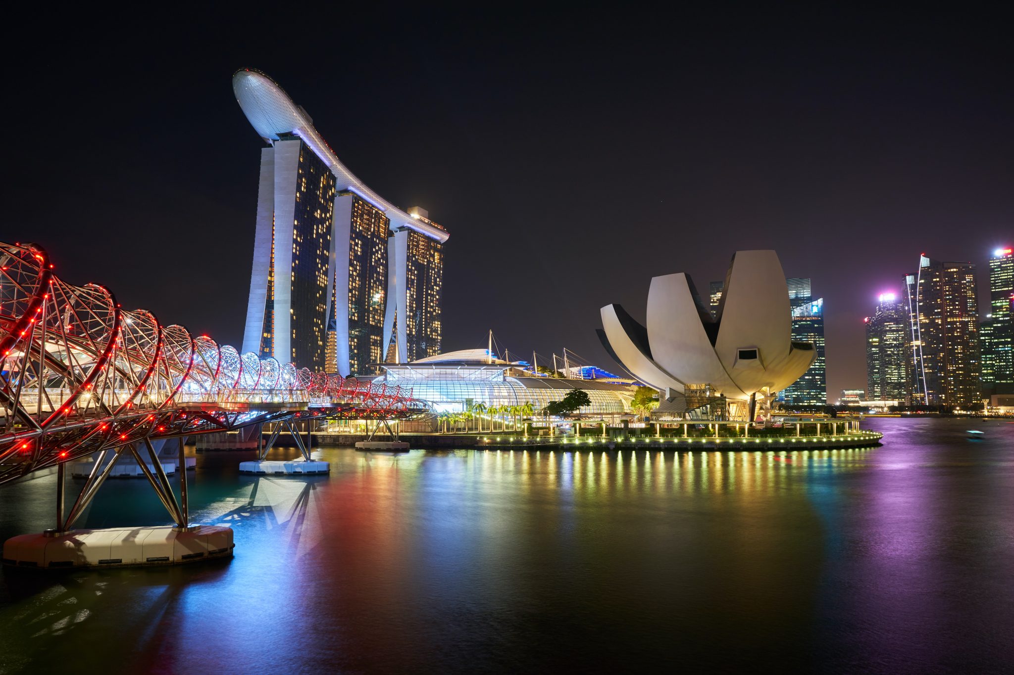 This image has an empty alt attribute; its file name is Singapore-buildings-scaled.jpg